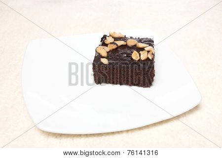 Brownie On Dish And Carpet Isolated On White Background