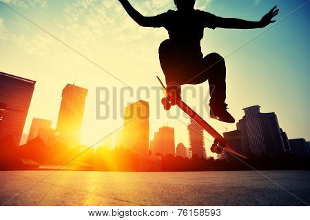 skateboarder skateboarding at sunrise city