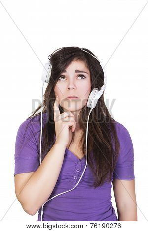 Brunette woman in headphones looking up dumbfounded isolated on white