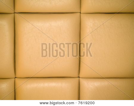 Fond capitonnés en cuir beige avec un motif répétitif