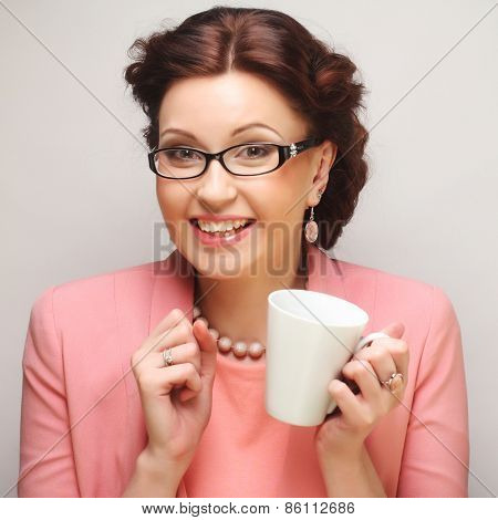 Young funny businesswoman having a coffee-break
