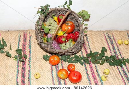 Wicker basket with fruits and vegetables.