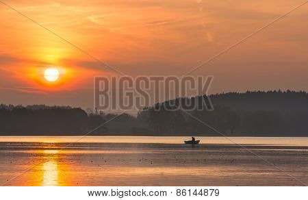Sunset Lake With Fisherman Boat Landscape.