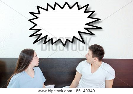 Handsome Man And Pretty Surprised Woman In Bedroom Looking Up