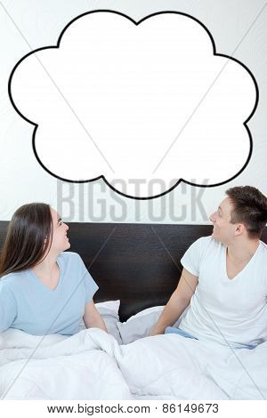 Happy Couple Looking Up At Empty Copyspace Cloud