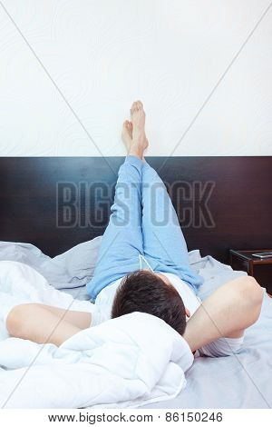 Young Man Resting, Chillout Or Sleeping In Bedroom
