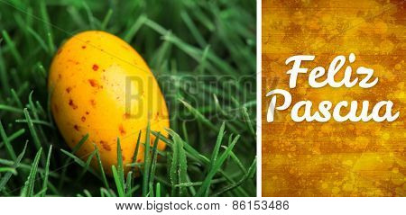 Feliz pascua against yellow paint splashed surface