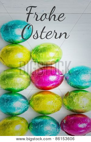 frohe ostern against many easter eggs with copy space