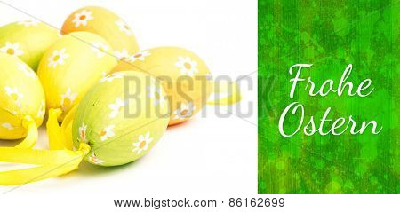 Frohe ostern against green paint splashed surface