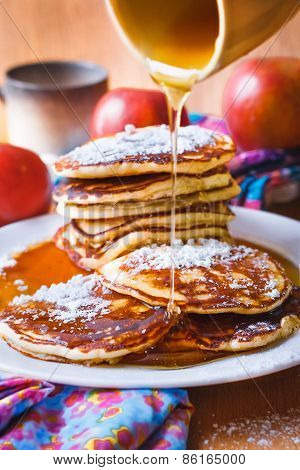 Stack of pancakes with maple syrup