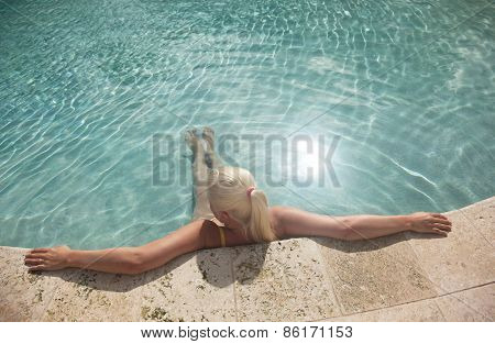 Girl Relaxing In The Pool