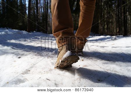 The person walking on a forest footpath