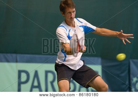 DNEPROPETROVSK, UKRAINE - APRIL 4, 2013: Sergey Stakhovsky, Ukraine on the training before Davis Cup match Ukraine vs Sweden. Ukraine won the match 3-2