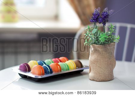 Assorted Macarons On A Table In Cafe
