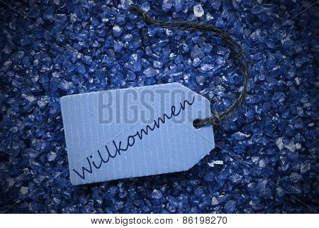 Purple Stones With Label Willkommen Means Welcome