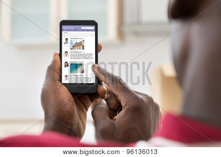 Man Surfing On Social Networking Site