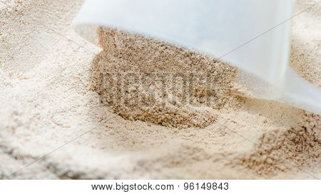 Isolate Protein Powder Chocolate Deluxe Flavour With Scoop Closeup