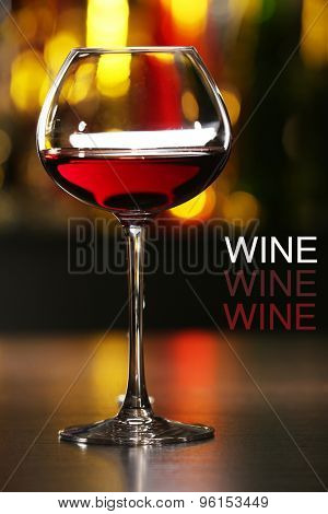 Glass of red wine in bar, close-up