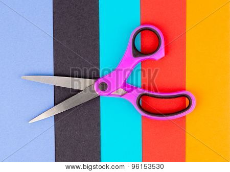 Scissors on coloured paper