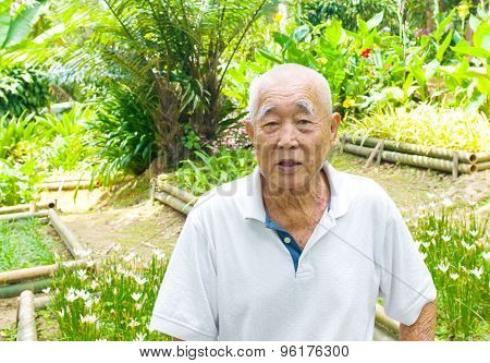 Smiling asian senior man.
