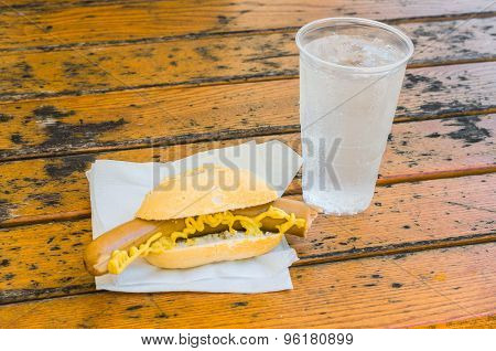 Sausage, Mustard In Sandwiches And Mineral Water