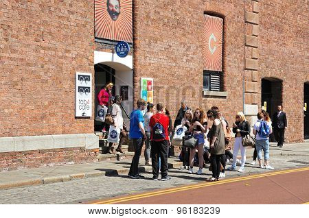 Tourists outside the Beatles Story Building.