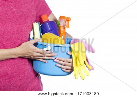 woman with cleaning equipment ready to clean house on white background