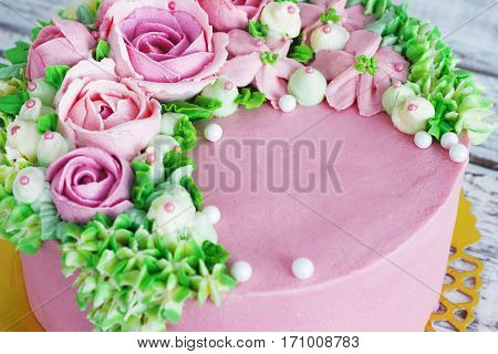 Birthday cake with flowers rose on white background.