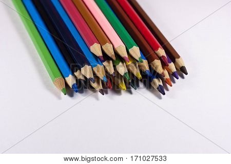 A pile of colored pencils on white background, isolated