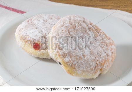 Food and Bakery Dish of Delicious Sweet Donuts Strawberry Jam and Blueberry Jam with Icing Toppings.