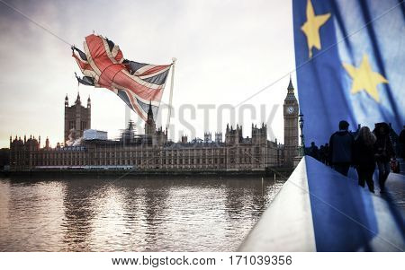 flags of UK and EU combined over icons of London - Brexit concept