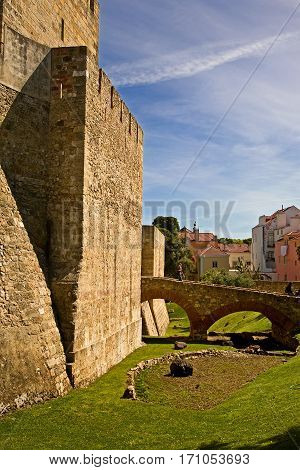 Castle keep at Sao Jorge castle in Lisbon, Portugal, complete with moat.