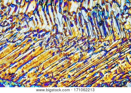 Colorful micro crystals through the microscope in polarized light