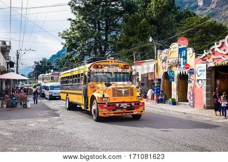 ANTIGUA,GUATEMALA -DEC 24, 2015:Typical guatemalan chicken bus in the steet of Antigua on Dec 24, 2015,Guatemala.Chicken bus It's a name for colorful, decorated bus in various latin American countries