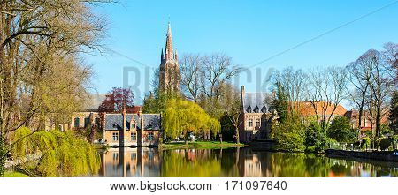 Banner lake panorama, reflection of gothic house, blue sky, spring in Bruges, Belgium