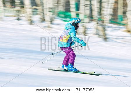 Irkutsk, Russia - February 12, 2017: Slalom competition snowboarding and skiing for adults and children in Irkutsk on the ski base in Akademgorodok Academy Cup in 2017