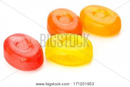 Four colorful fruit hard sugar candies,  boiled sweeties or sugar plums isolated on white background cutout