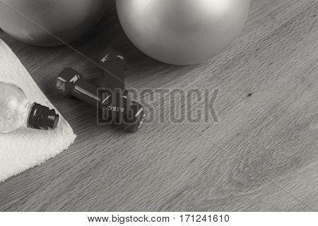 Fitness equipmen on a wooden background. Weight loss and fitness.