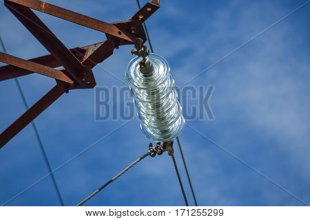 Glass Prefabricated High Voltage Insulators On Poles High-voltage Power Lines. Electrical Industry