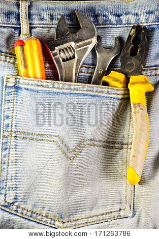 Different Hand Tools In A Pocket Of The Jeans