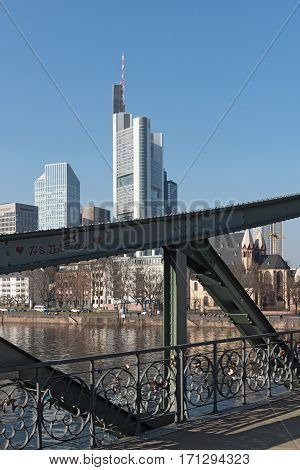 FRANKFURT, GERMANY-FEBRUARY 14, 2017: View of Frankfurt am Main skyline and Eiserner Steg bridge