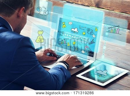 Business, Technology, Internet And Networking Concept. Young Businessman Working On His Laptop In Th