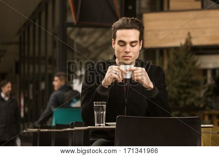 Young Man Drinking, Coffee Cup, Outdoors Passersby