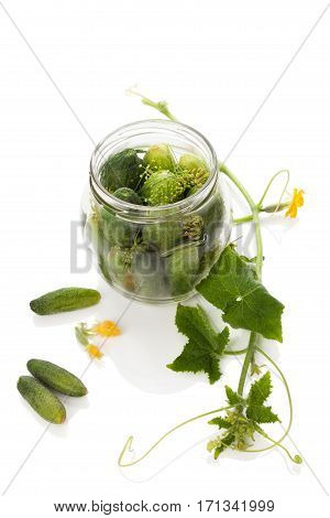 Pickles. Cucumbers in glass jar isolated on white background.