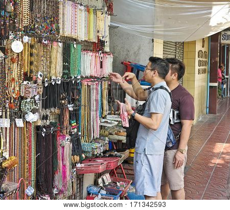 BANGKOK, THAILAND-FEBRUARY 04,2017 : People choose to purchase the necklace at the market of Sempeng Chinatown on Bangkok, Thailand
