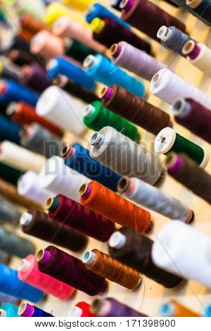 Yarn on spools in many colors at tailor shop