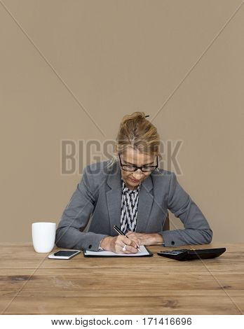 Businesswoman writing down a plan and strategy