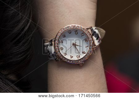 close up fashion details young business woman and her watch.