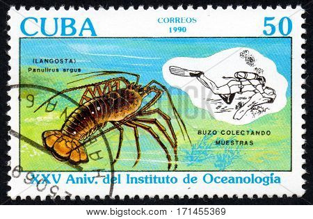 UKRAINE - CIRCA 2017: a stamp printed in Cuba shows lobsters crabs sea large cancer. The diver diving collecting lobster around 1990