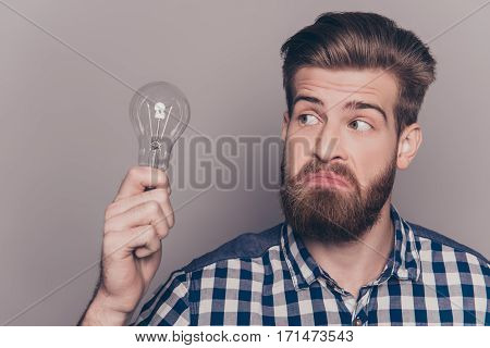 Portrait Of Young Genious Man With Idea Holding Lamp